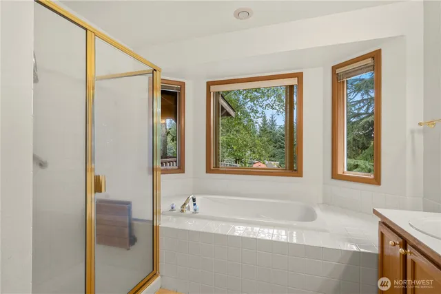 a large kitchen with stainless steel appliances granite countertop a stove and a sink