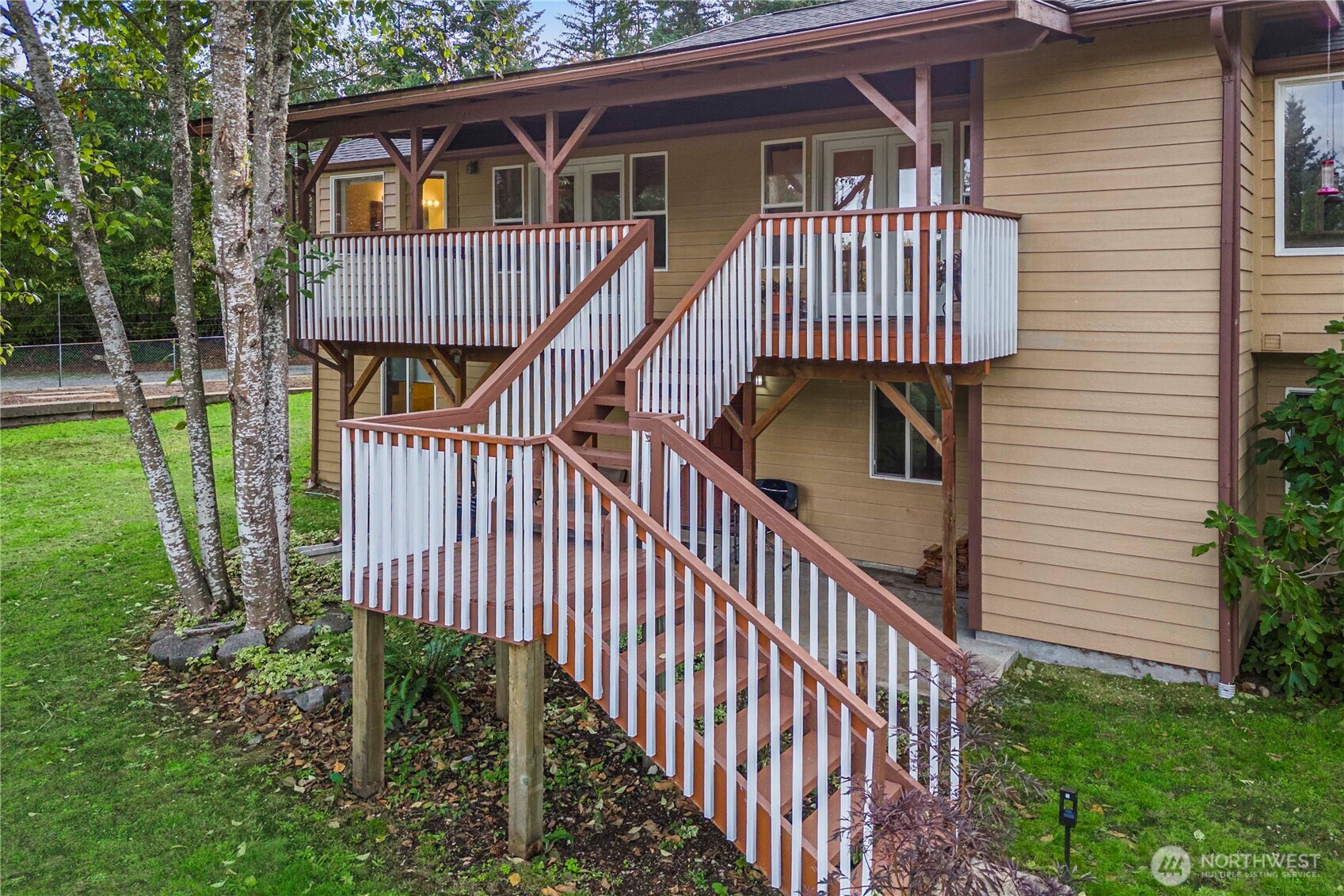 21103 16th Street East Lake Tapps, WA 98391 - Photo 25 of 30 a view of a house with a deck