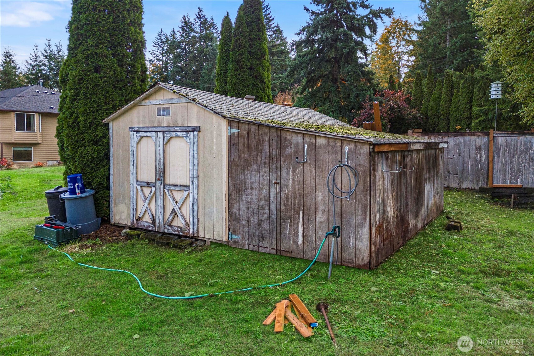 21103 16th Street East Lake Tapps, WA 98391 - Photo 27 of 30 a view of a backyard with wooden fence