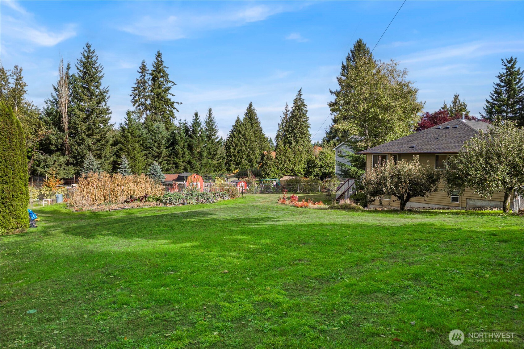 21103 16th Street East Lake Tapps, WA 98391 - Photo 28 of 30 a front view of a house with garden