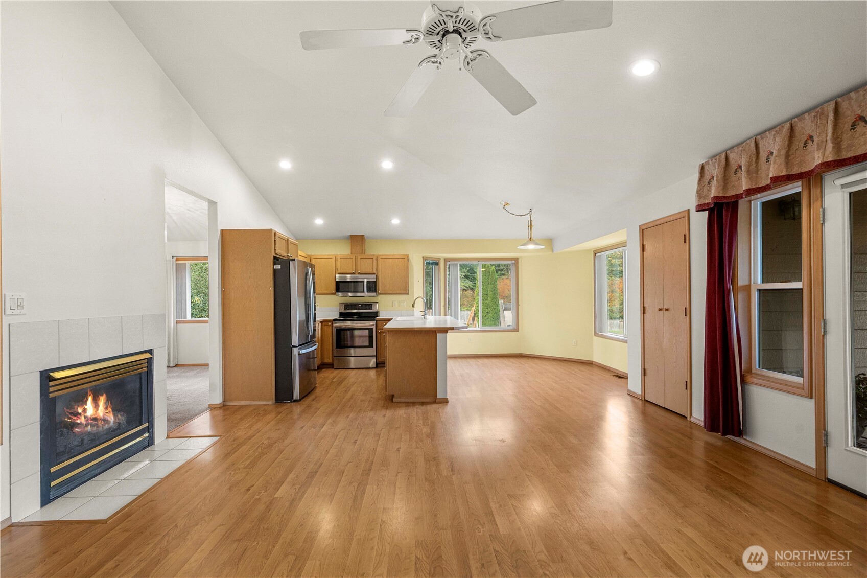 21103 16th Street East Lake Tapps, WA 98391 - Photo 3 of 30 a view of a livingroom with furniture and a fireplace