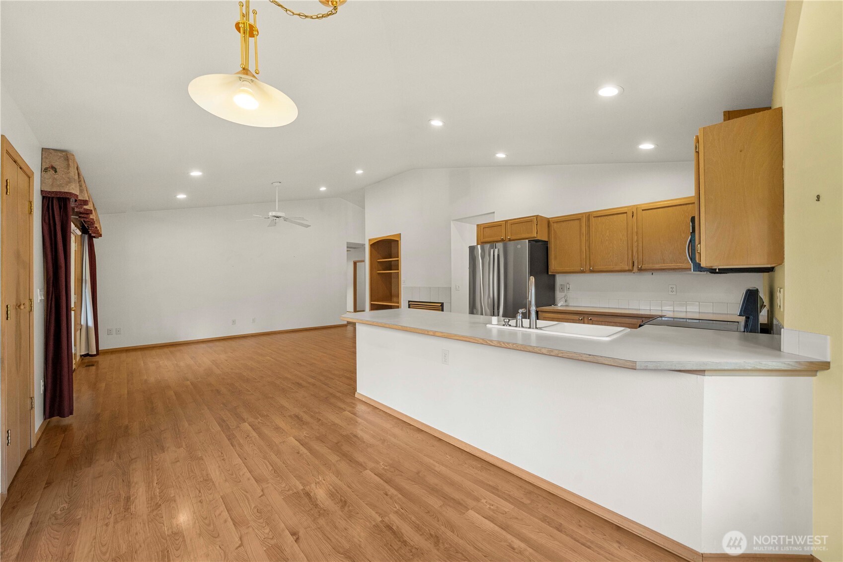 21103 16th Street East Lake Tapps, WA 98391 - Photo 5 of 30 a view of kitchen with wooden floor