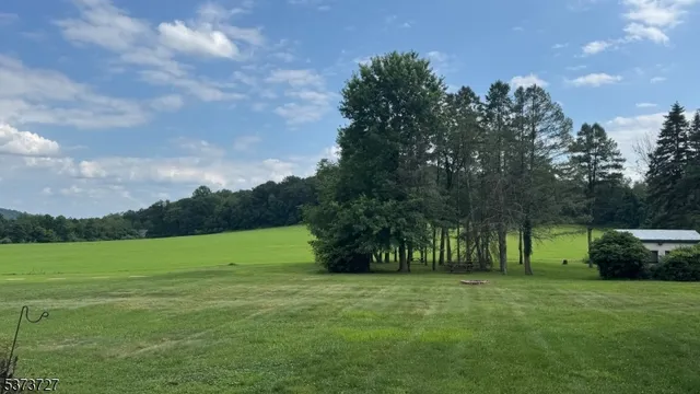 a view of outdoor space with deck and yard