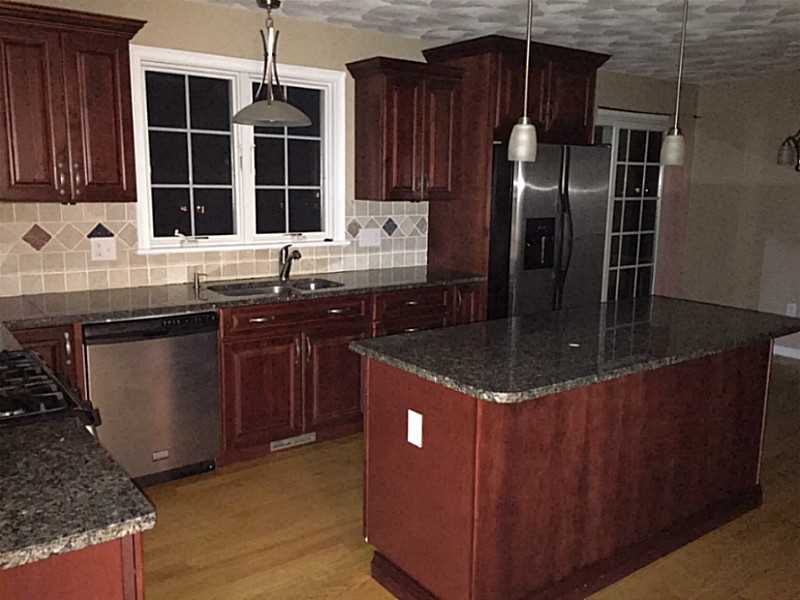 55 Dye Hill Road Hopkinton, RI 02832 - Photo 5 of 22 Kitchen. Dark Cherry Cabinets with beautiful detailed trim molding