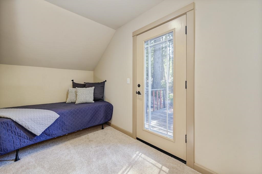 33350 Main Street Dutch Flat, CA 95714 - Photo 9 of 21 a bedroom with a bed and a glass door