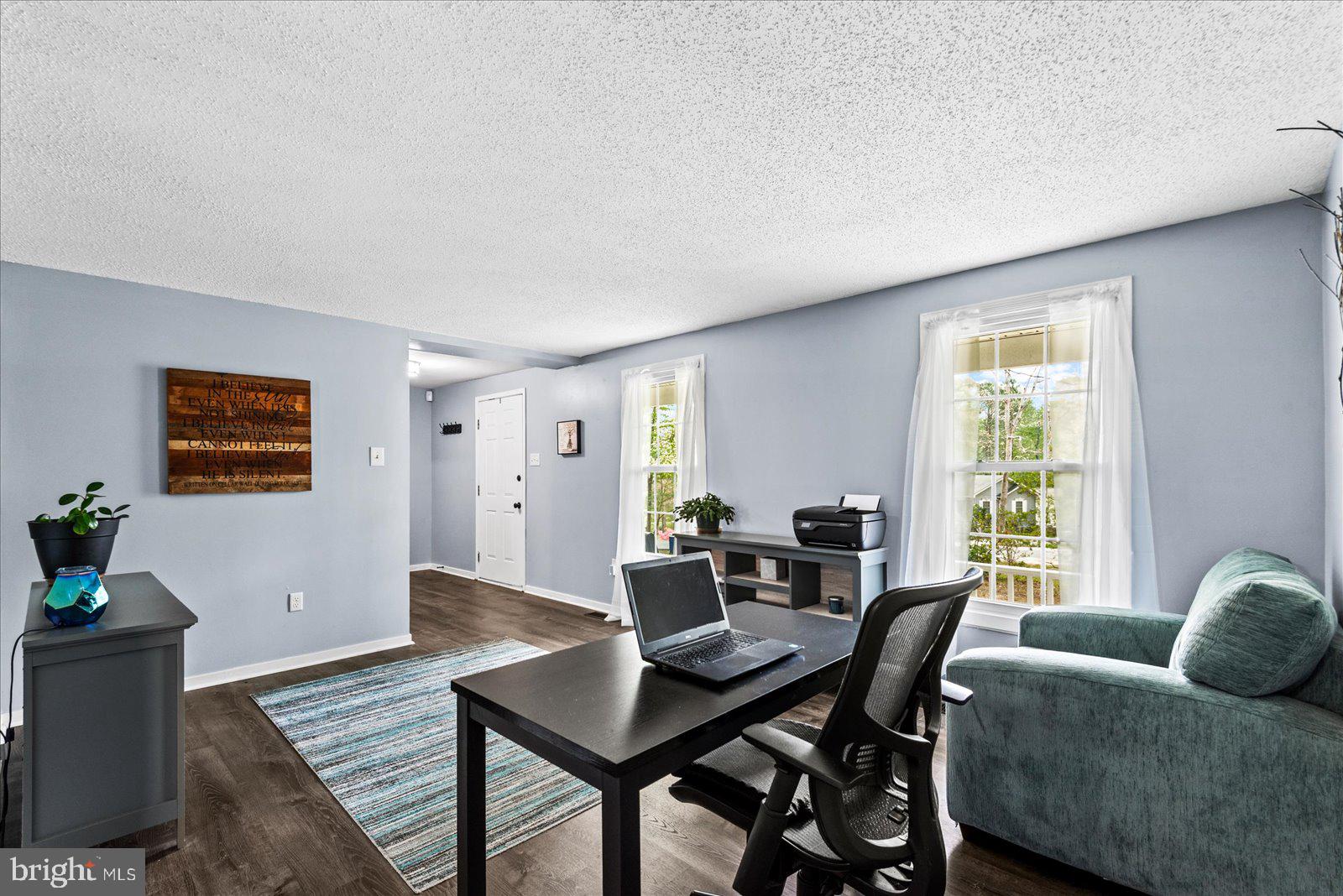 218 Victoria Drive Ruther Glen, VA 22546 - Photo 11 of 73 a living room with furniture and wooden floor