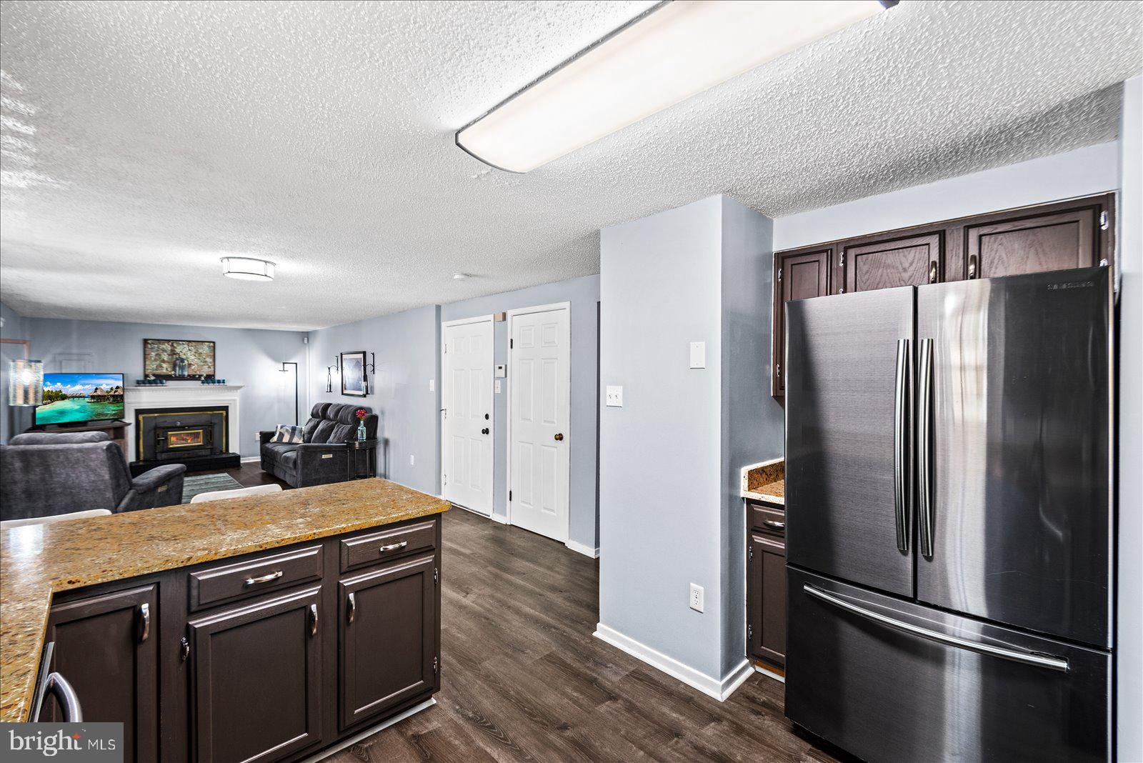 218 Victoria Drive Ruther Glen, VA 22546 - Photo 17 of 73 a kitchen with stainless steel appliances granite countertop a refrigerator a sink and a stove