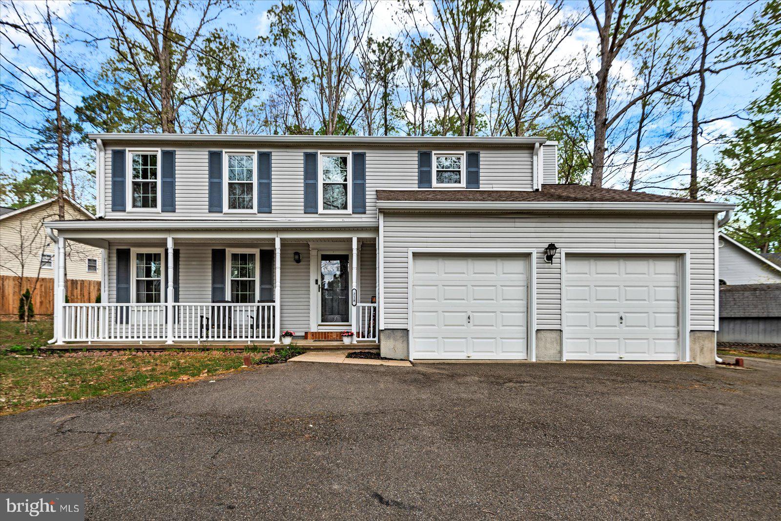 218 Victoria Drive Ruther Glen, VA 22546 - Photo 2 of 73 front view of a house with a yard