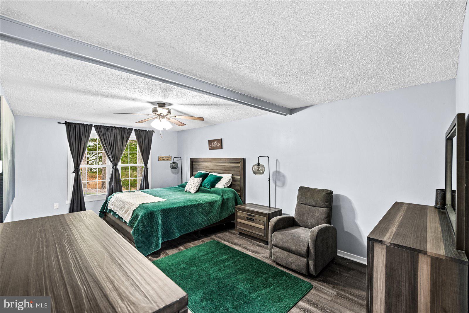 218 Victoria Drive Ruther Glen, VA 22546 - Photo 28 of 73 a bedroom with two beds and a large window