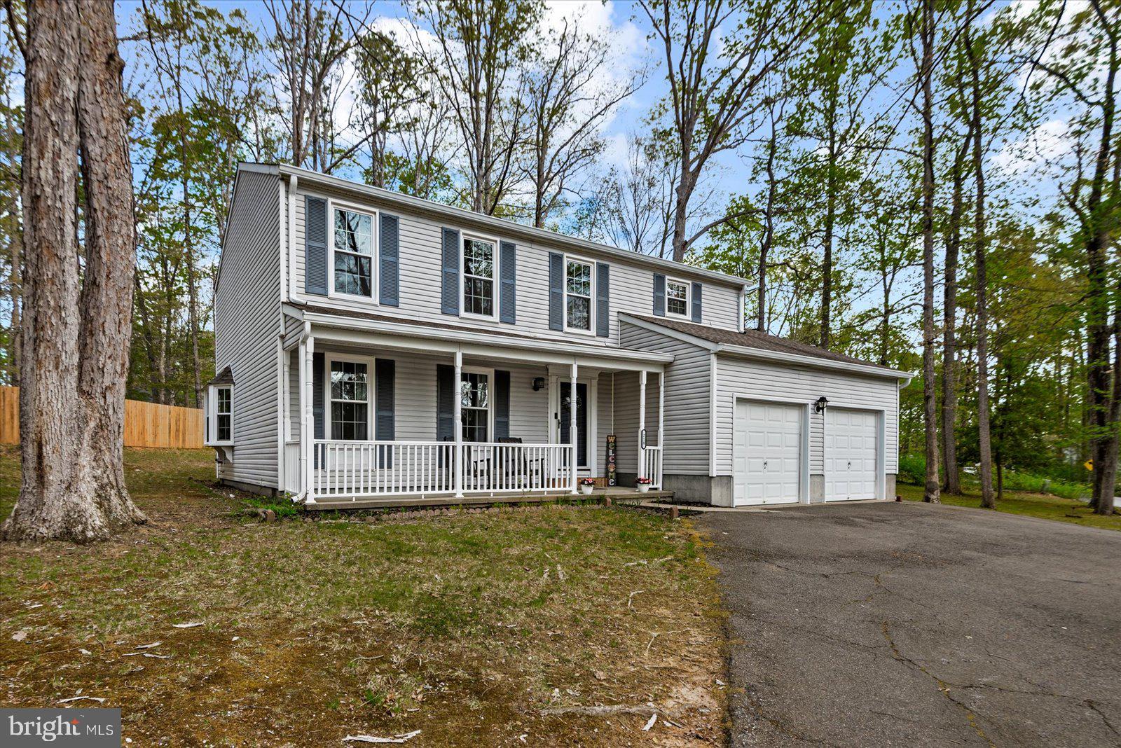 218 Victoria Drive Ruther Glen, VA 22546 - Photo 3 of 73 a front view of a house with a yard
