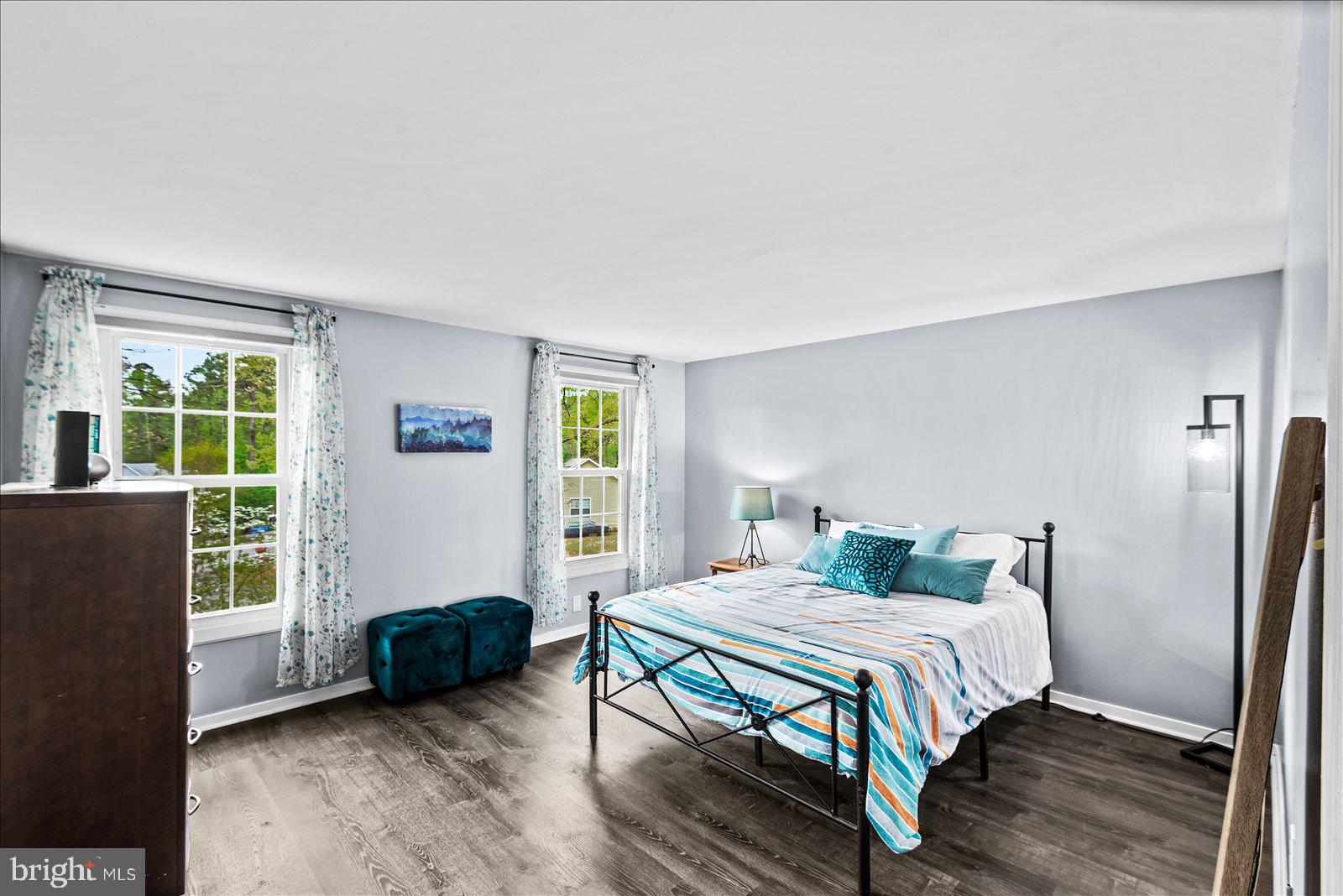218 Victoria Drive Ruther Glen, VA 22546 - Photo 32 of 73 a bedroom with a bed and a window with wooden floor