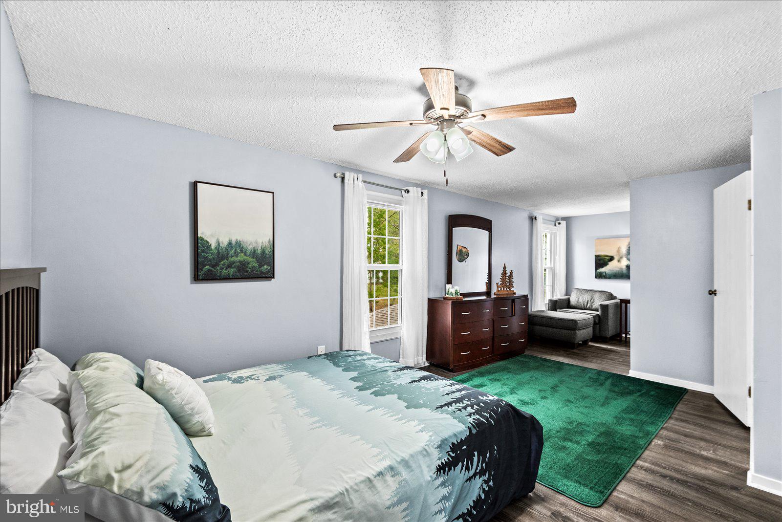 218 Victoria Drive Ruther Glen, VA 22546 - Photo 35 of 73 a bedroom with a bed and a chandelier
