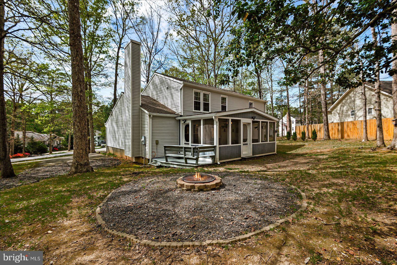 218 Victoria Drive Ruther Glen, VA 22546 - Photo 43 of 73 a front view of a house with a yard