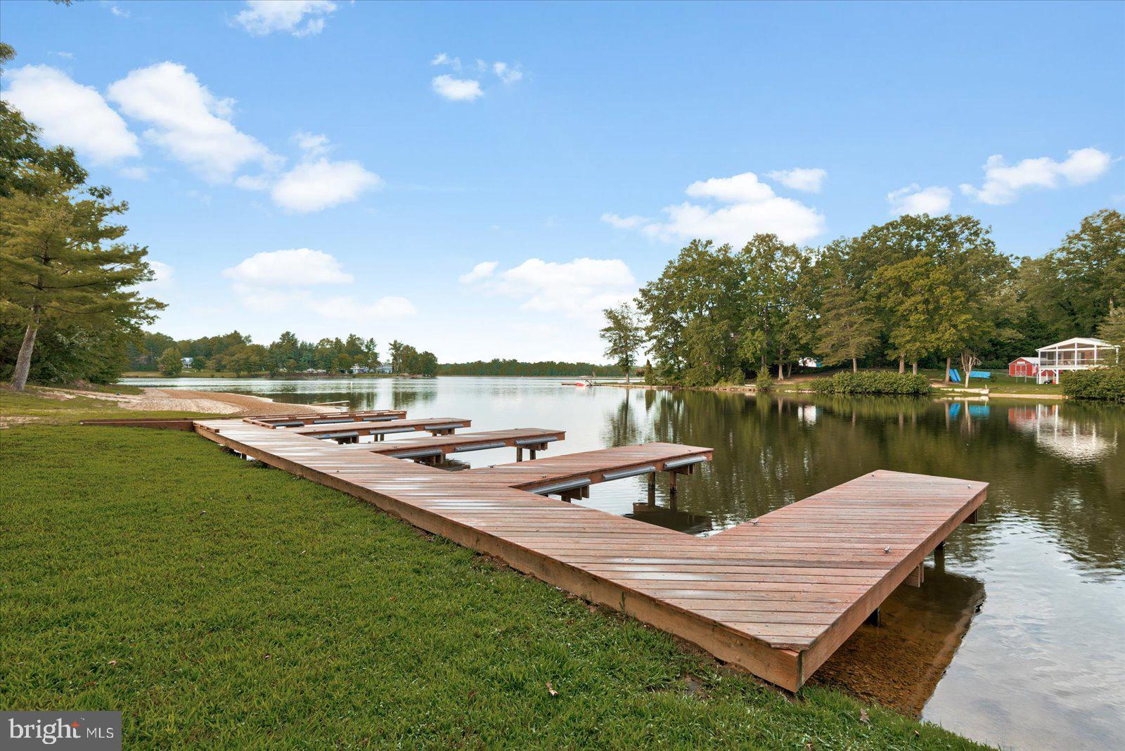 218 Victoria Drive Ruther Glen, VA 22546 - Photo 55 of 73 a view of a lake with houses in the back