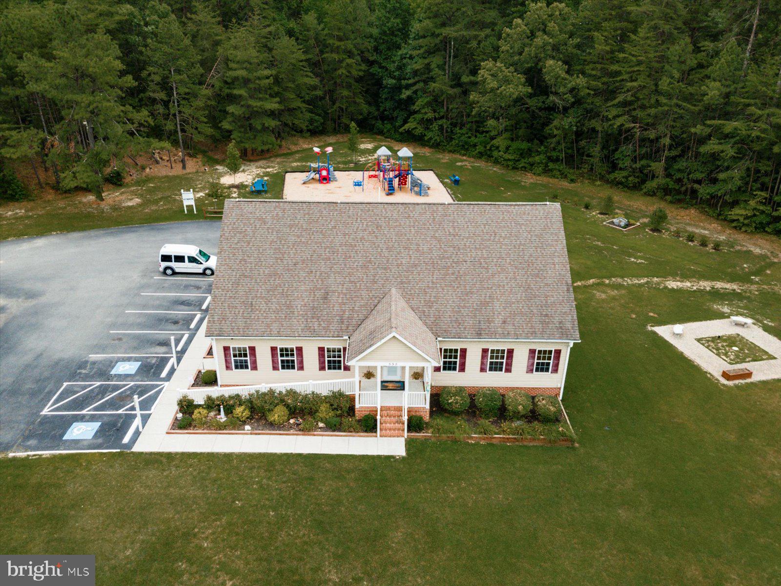218 Victoria Drive Ruther Glen, VA 22546 - Photo 59 of 73 a aerial view of a house with swimming pool and a yard