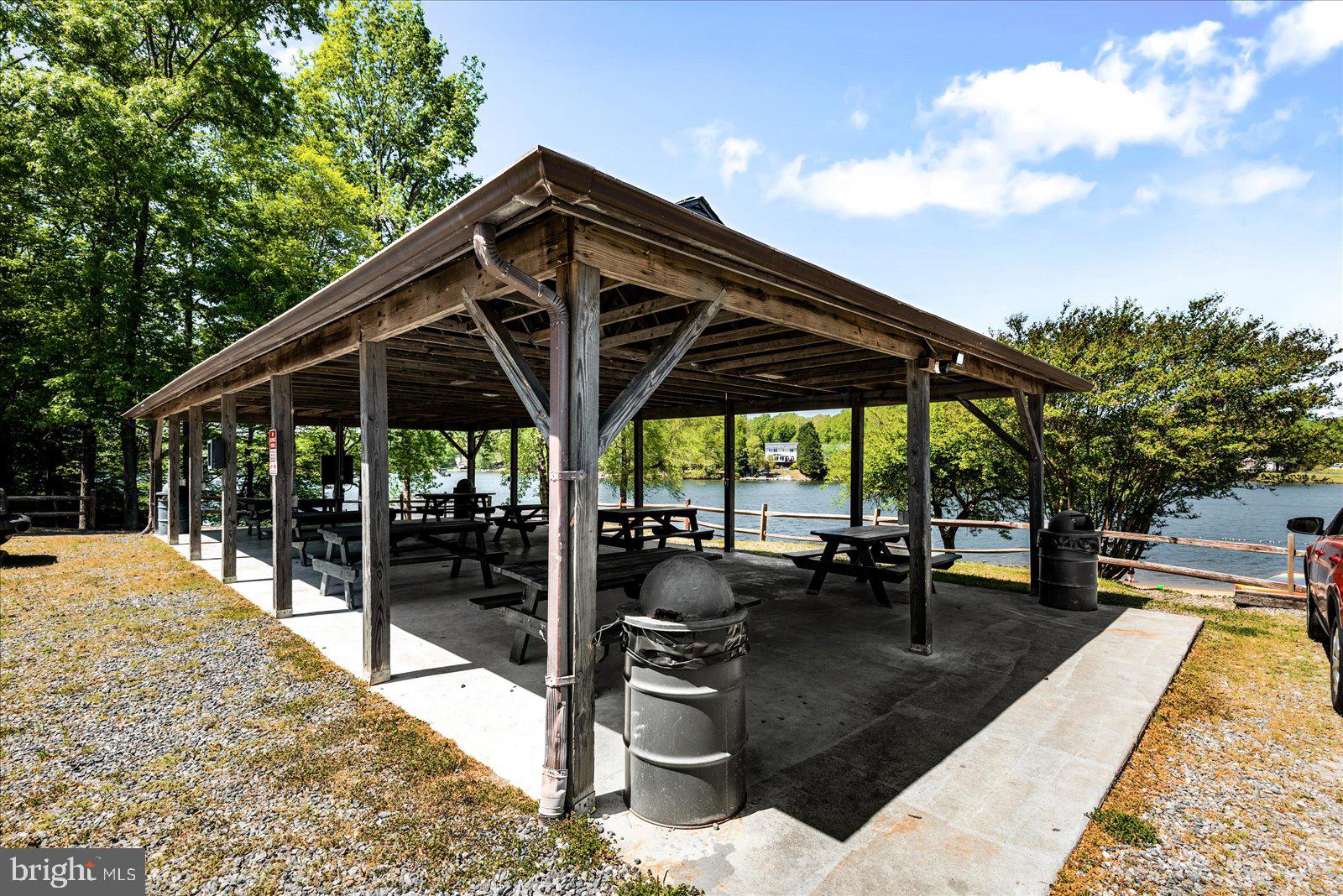 218 Victoria Drive Ruther Glen, VA 22546 - Photo 62 of 73 a view of patio with chairs and potted plants