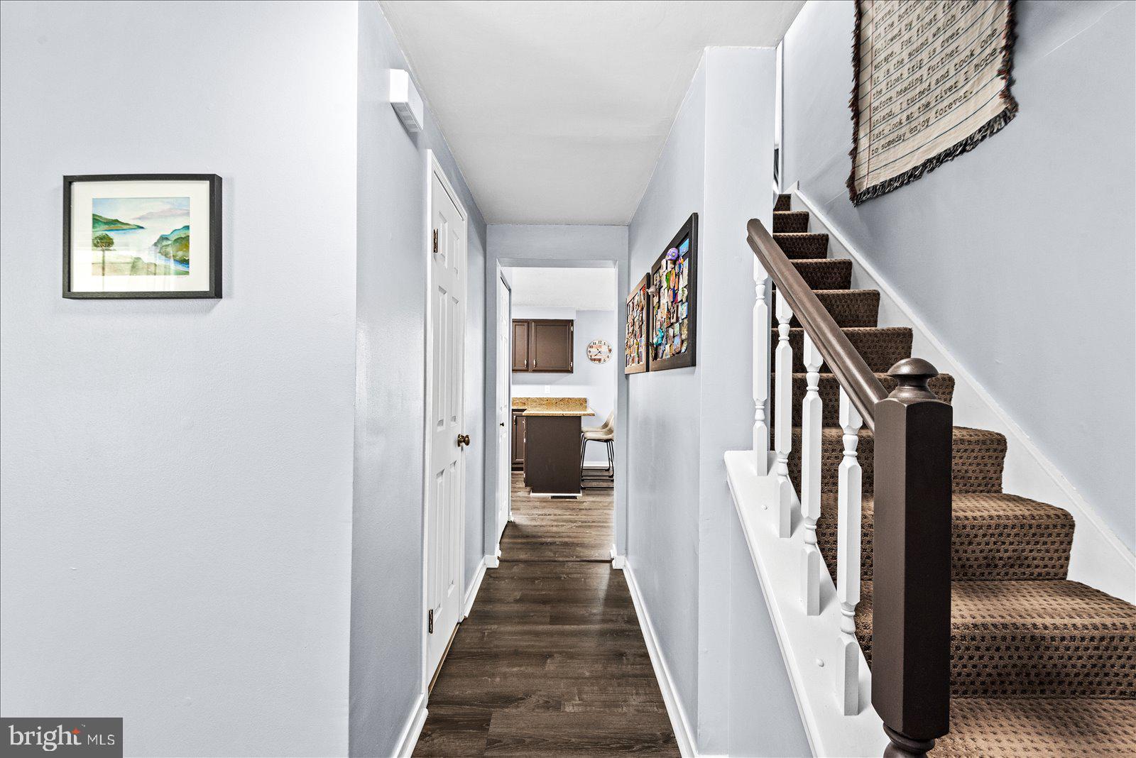 218 Victoria Drive Ruther Glen, VA 22546 - Photo 7 of 73 a view of a hallway with wooden floor and staircase