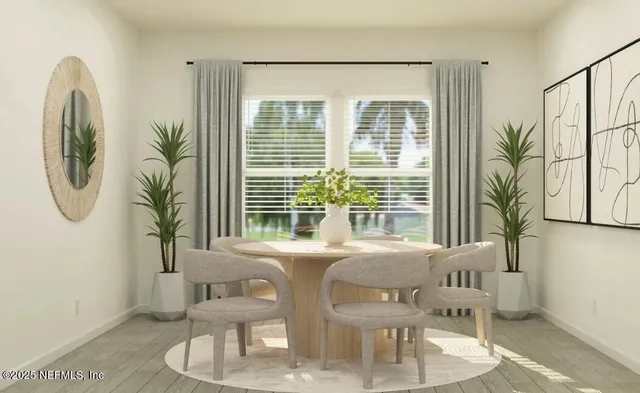 a kitchen with a refrigerator a stove a sink cabinets and wooden floor