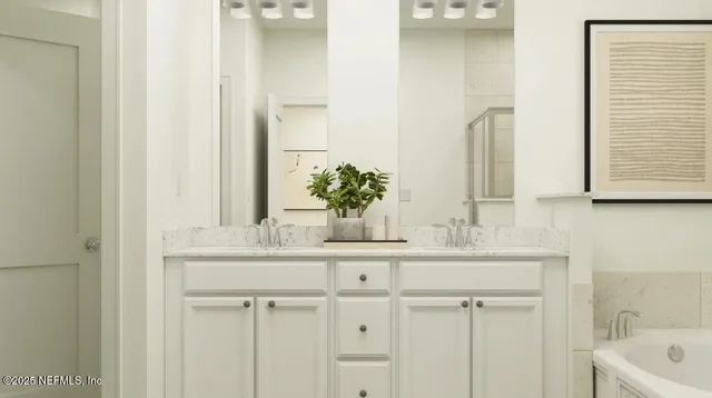 a bedroom with furniture and a flat screen tv