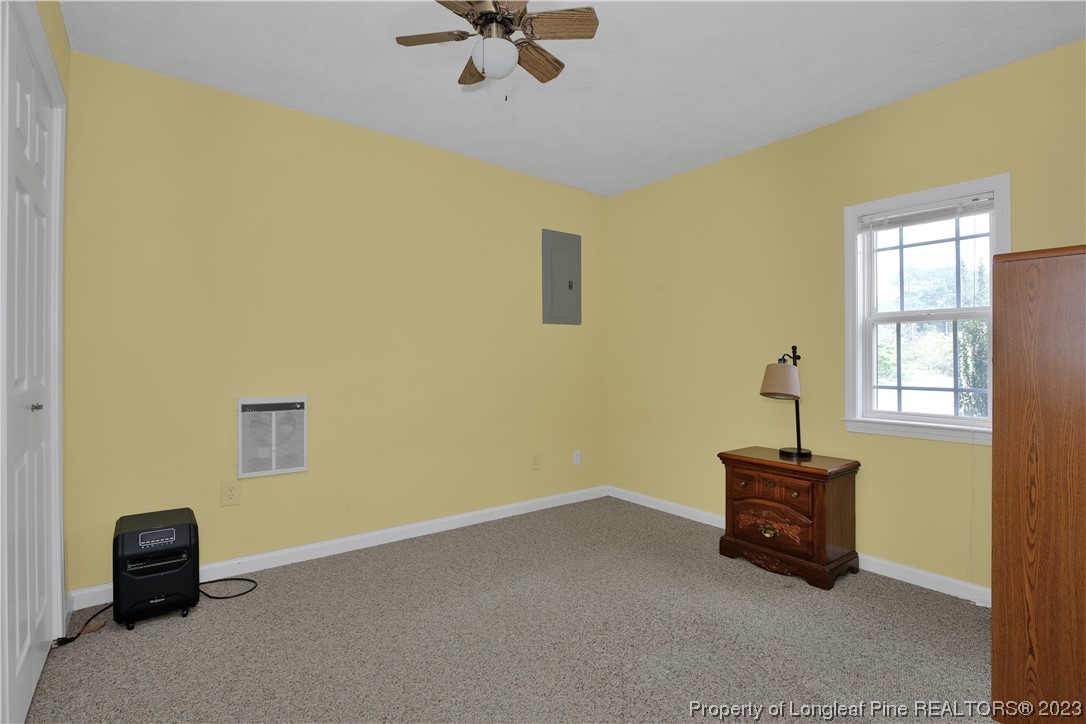 6015 Goldsboro Road Wade, NC 28395 - Photo 45 of 50 a room with a computer on a desk and a chair