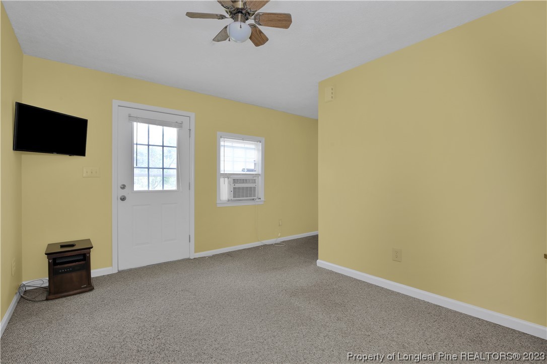 6015 Goldsboro Road Wade, NC 28395 - Photo 48 of 50 a view of a livingroom with a flat screen tv