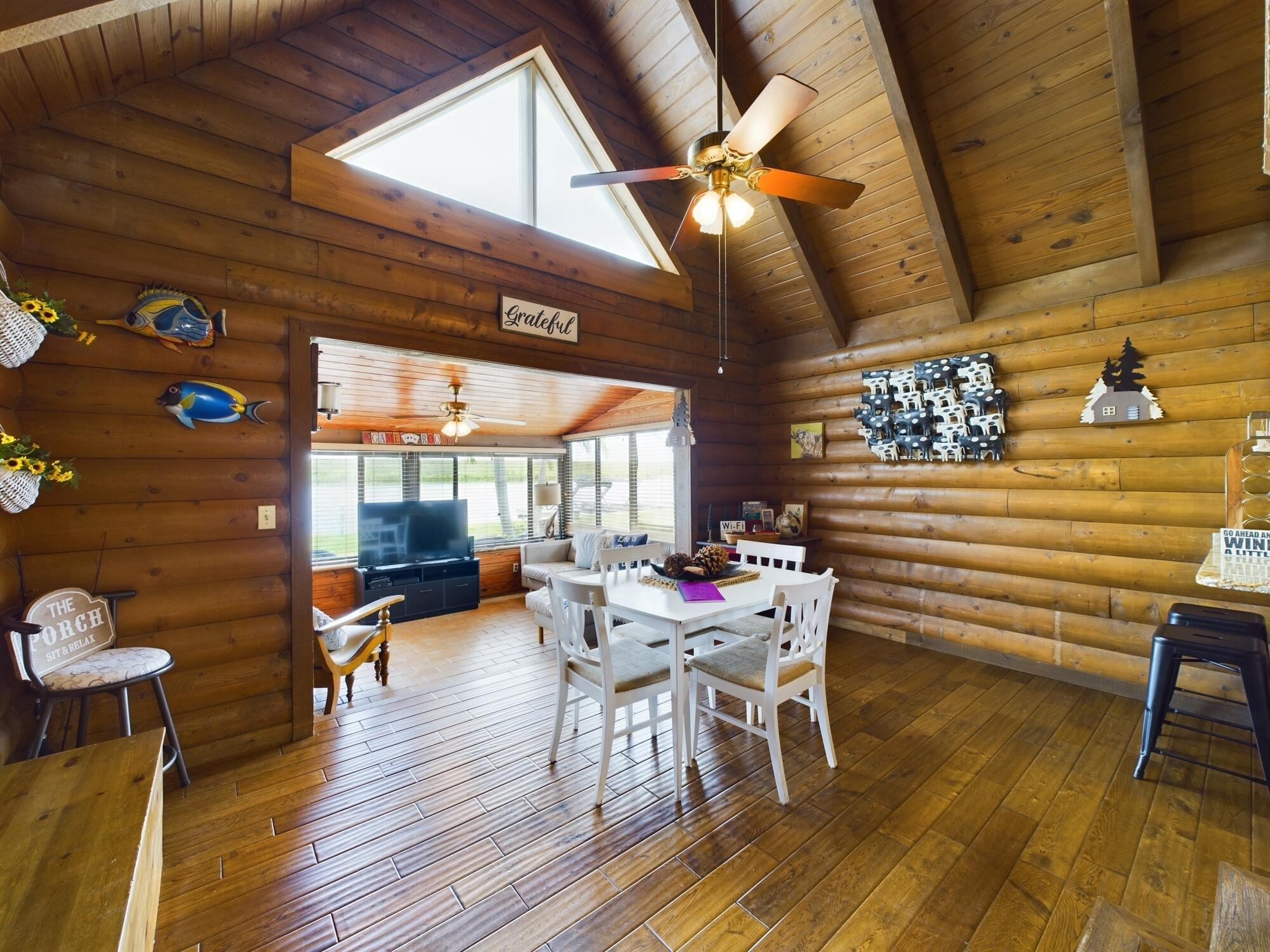 8348 Highway 441 Okeechobee, FL 34974 - Photo 11 of 25 a view of a dining room with furniture and wooden floor