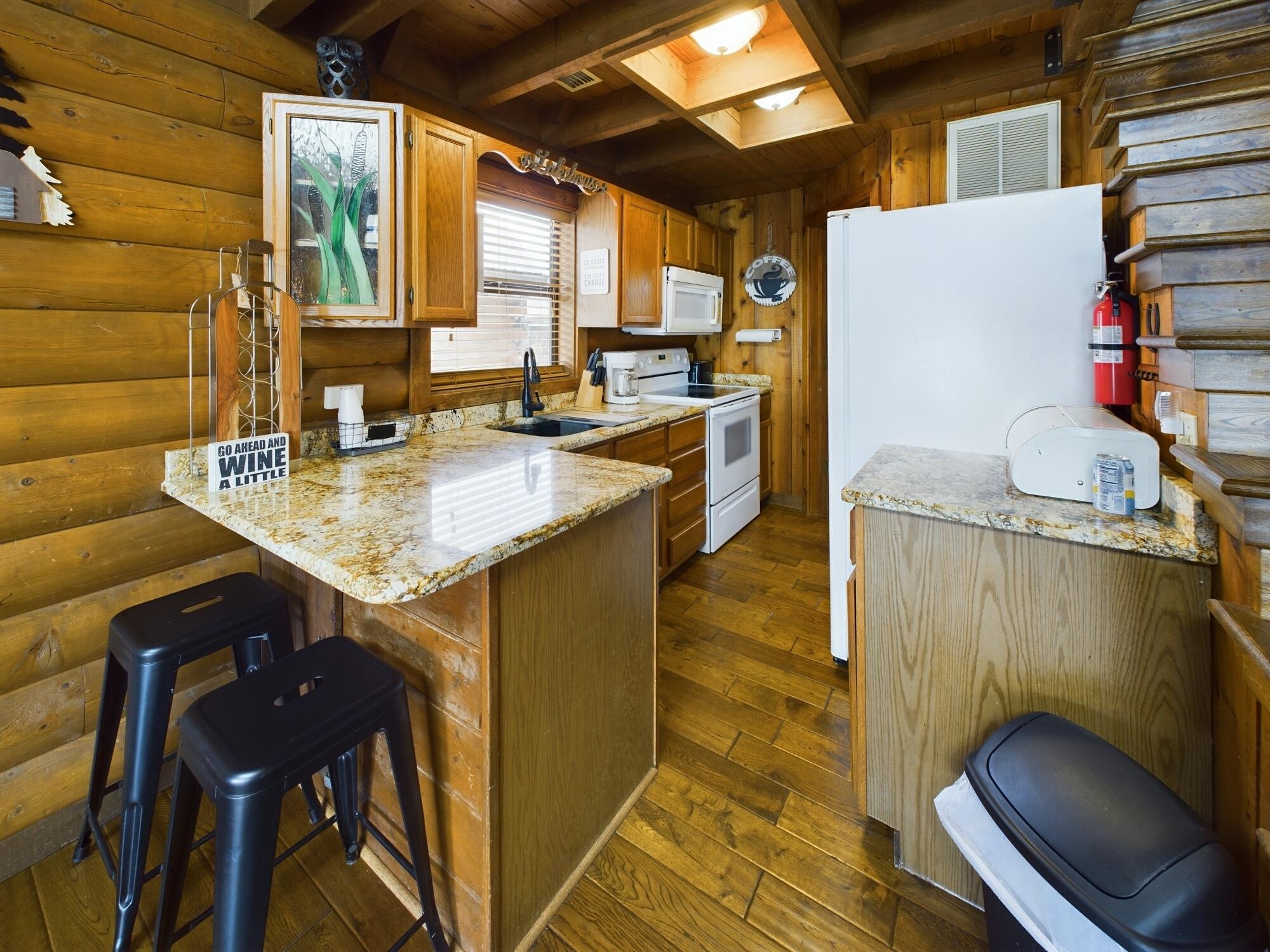 8348 Highway 441 Okeechobee, FL 34974 - Photo 16 of 25 a kitchen with a sink refrigerator and cabinets