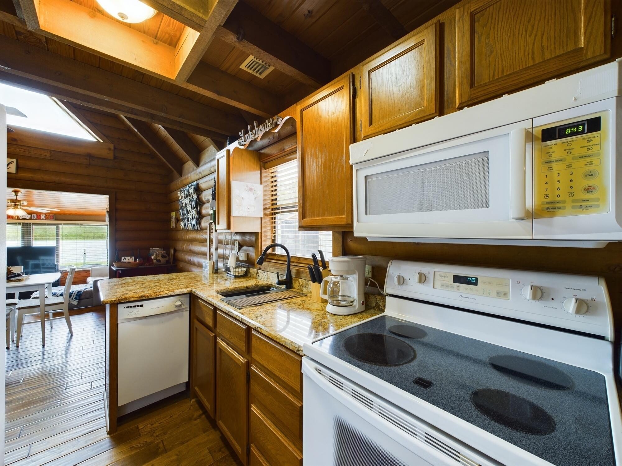 8348 Highway 441 Okeechobee, FL 34974 - Photo 17 of 25 a kitchen with a stove sink and cabinets