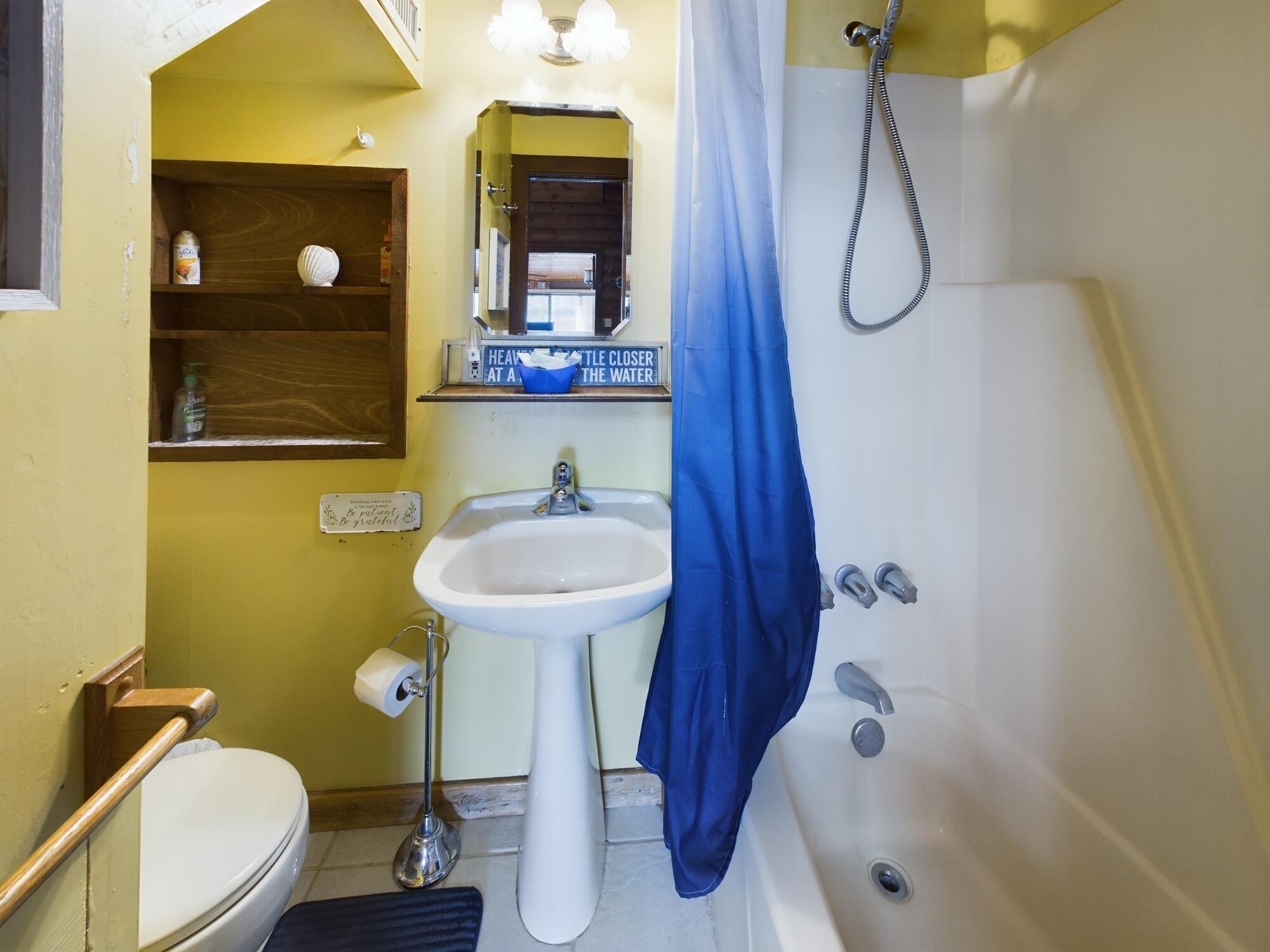 8348 Highway 441 Okeechobee, FL 34974 - Photo 21 of 25 a bathroom with a sink mirror and toilet
