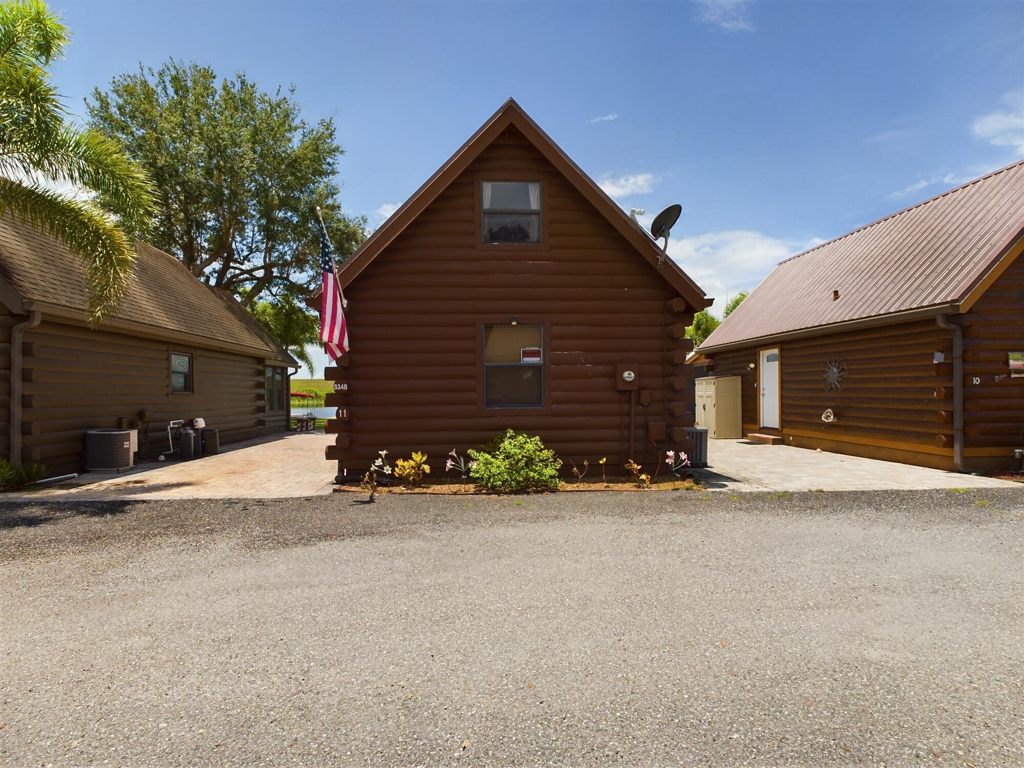 8348 Highway 441 Okeechobee, FL 34974 - Photo 4 of 25 a view of a house with a street