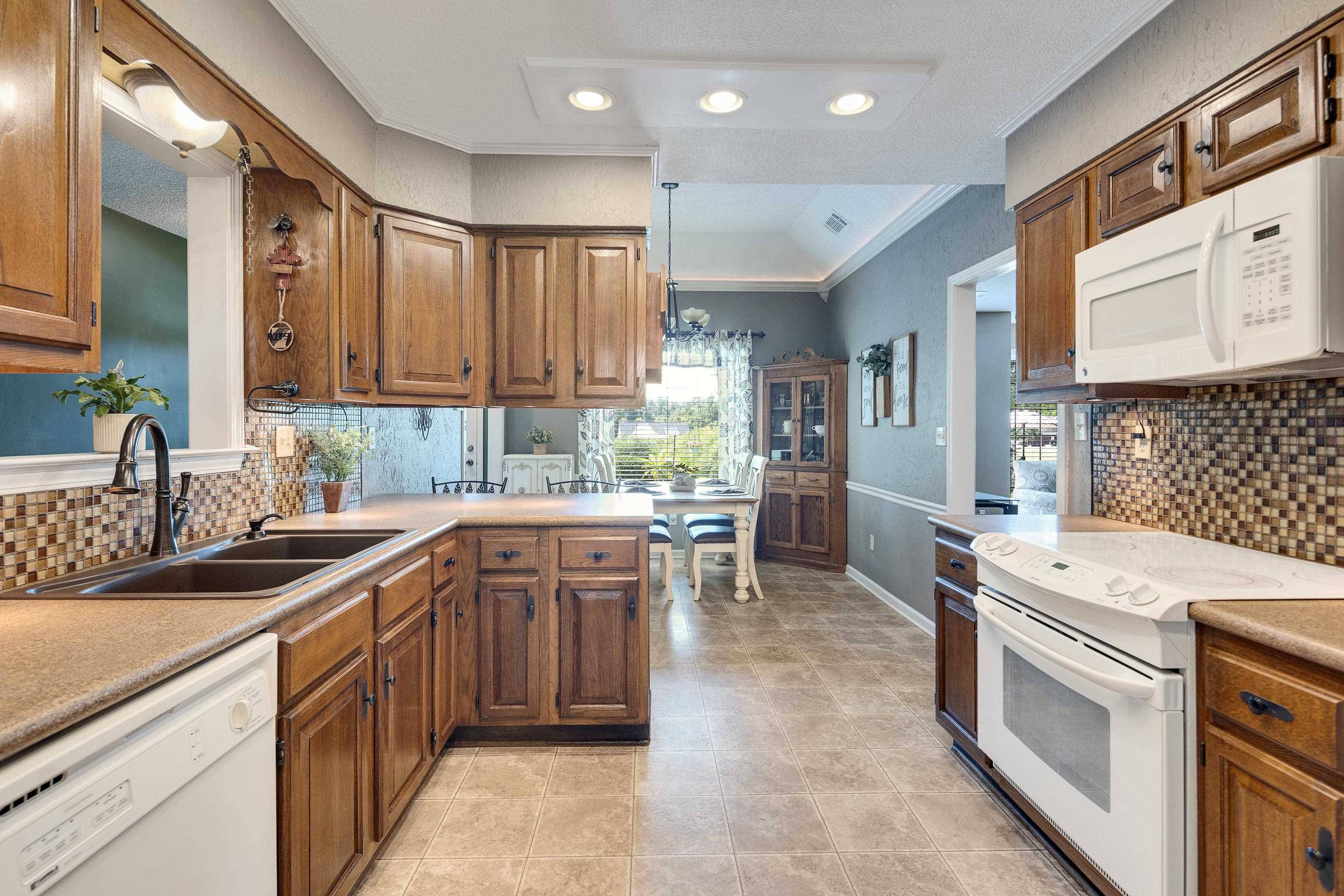 6125 Pleasant Ridge Road Millington, TN 38053 - Photo 11 of 40 a kitchen that has a sink and a stove in it