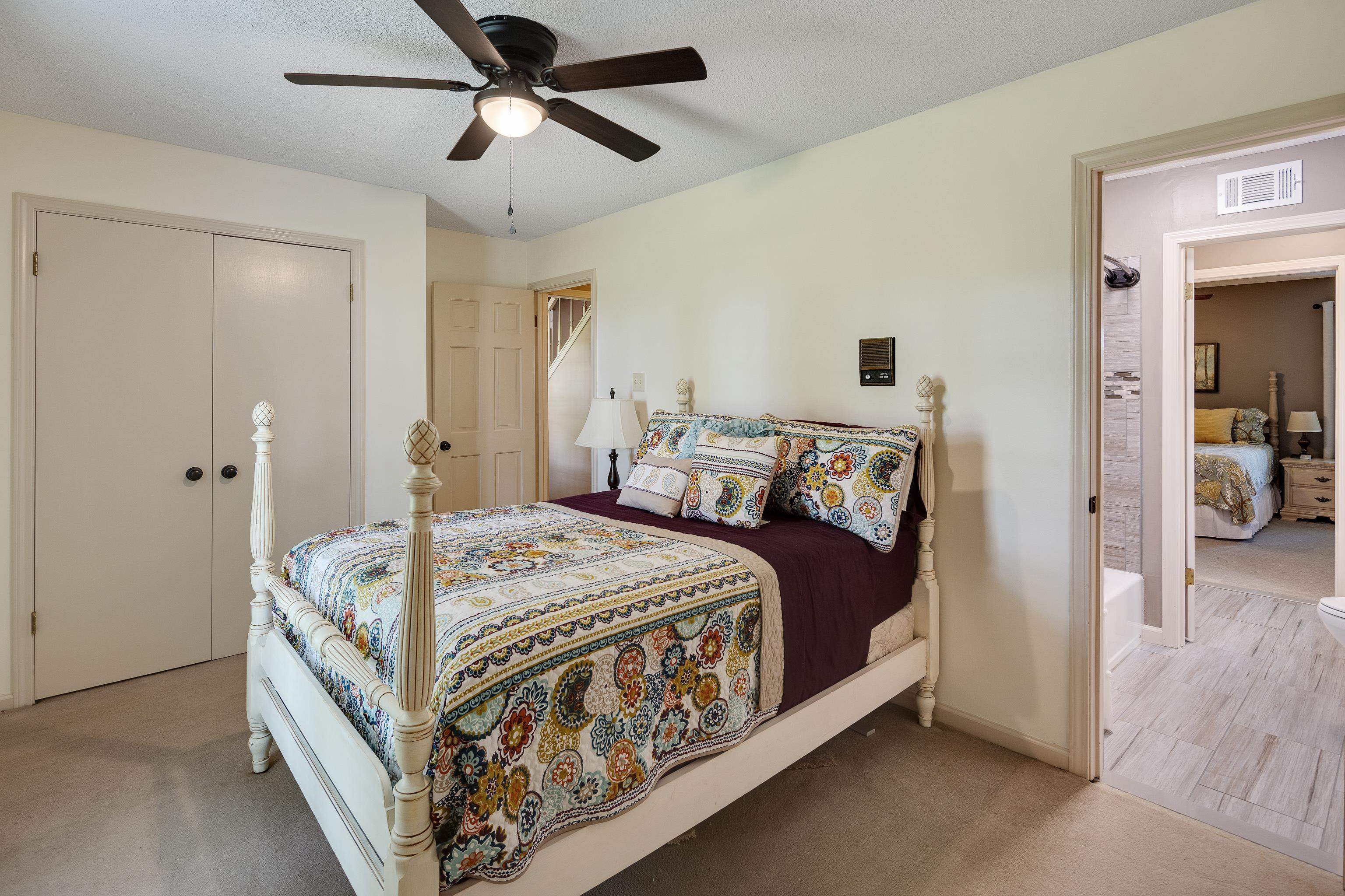 6125 Pleasant Ridge Road Millington, TN 38053 - Photo 19 of 40 a bed room with a bed and a chandelier