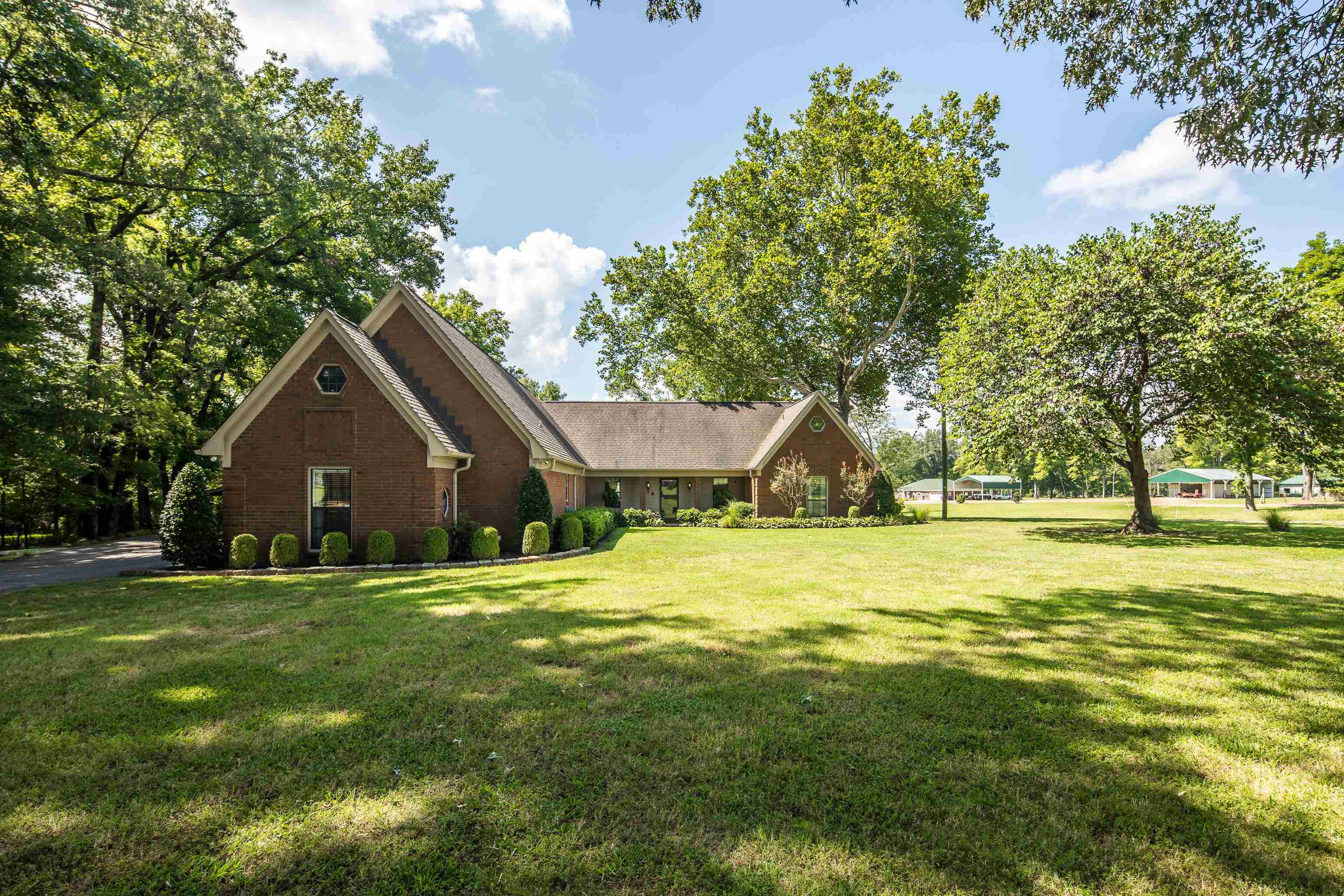 6125 Pleasant Ridge Road Millington, TN 38053 - Photo 35 of 40 a front view of a house with a yard and trees