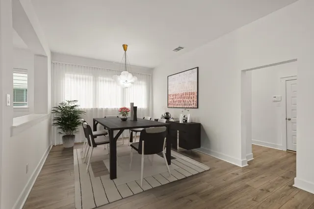 a view of a dining room with furniture and window