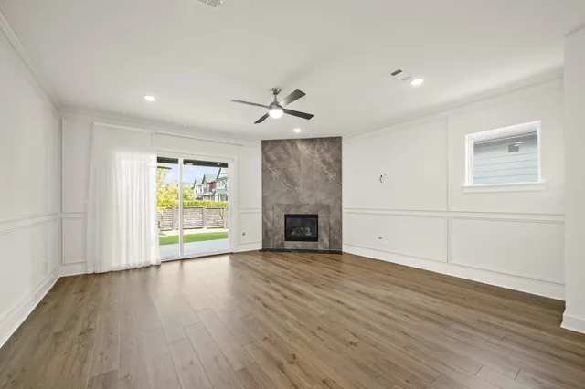 wooden floor in an empty room with a window