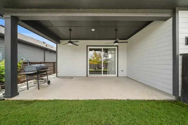 a view of an chairs and table in the patio