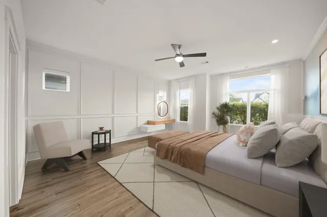 a bedroom with a large bed and a window