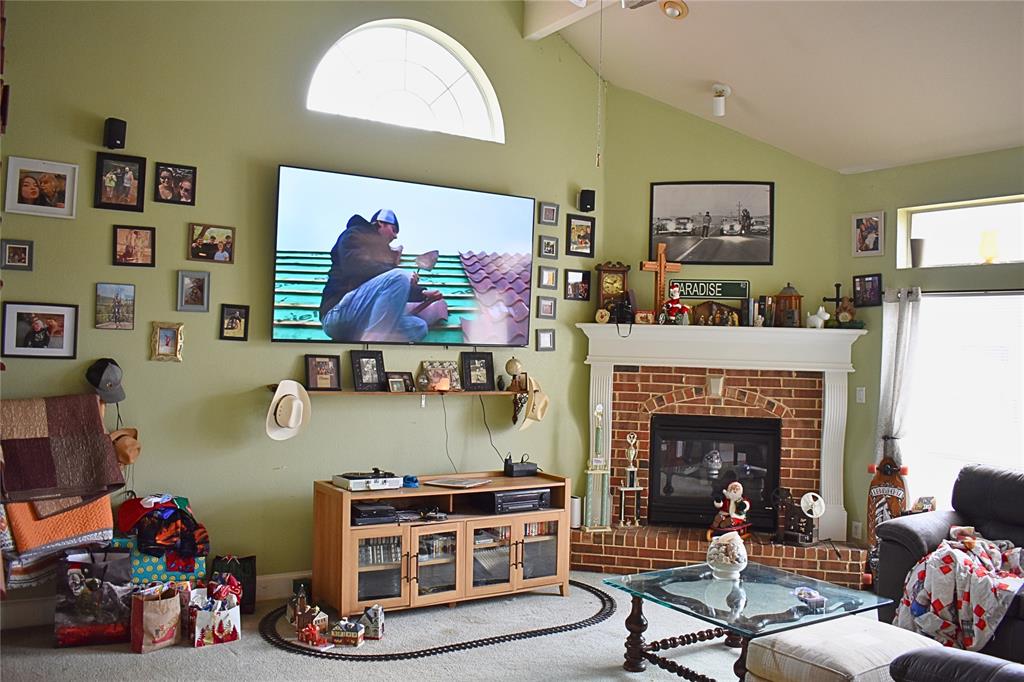 311 Ridge Hollow Trail Venus, TX 76084 - Photo 18 of 38 a living room with furniture and a fireplace