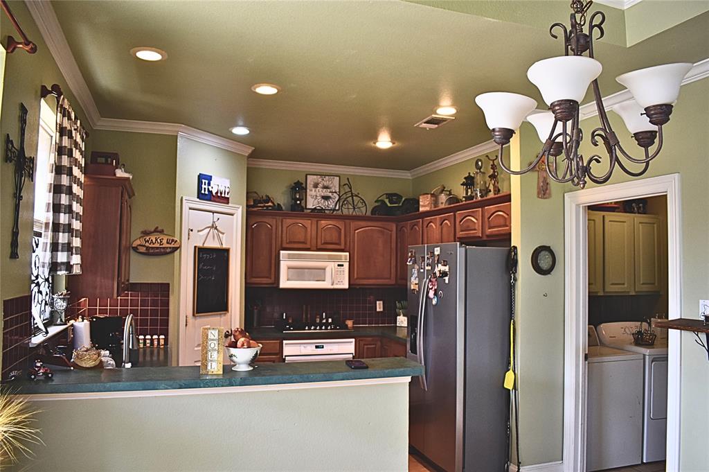 311 Ridge Hollow Trail Venus, TX 76084 - Photo 27 of 38 a view of a entryway and a room with shelves
