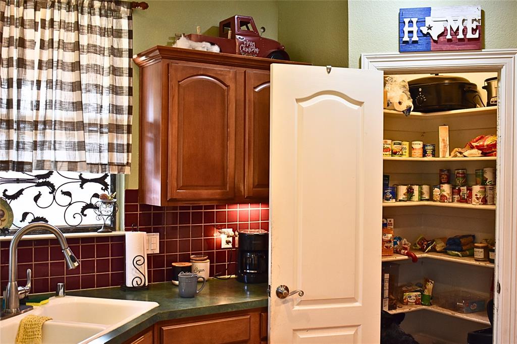 311 Ridge Hollow Trail Venus, TX 76084 - Photo 29 of 38 a bathroom with a sink a toilet and shower curtain