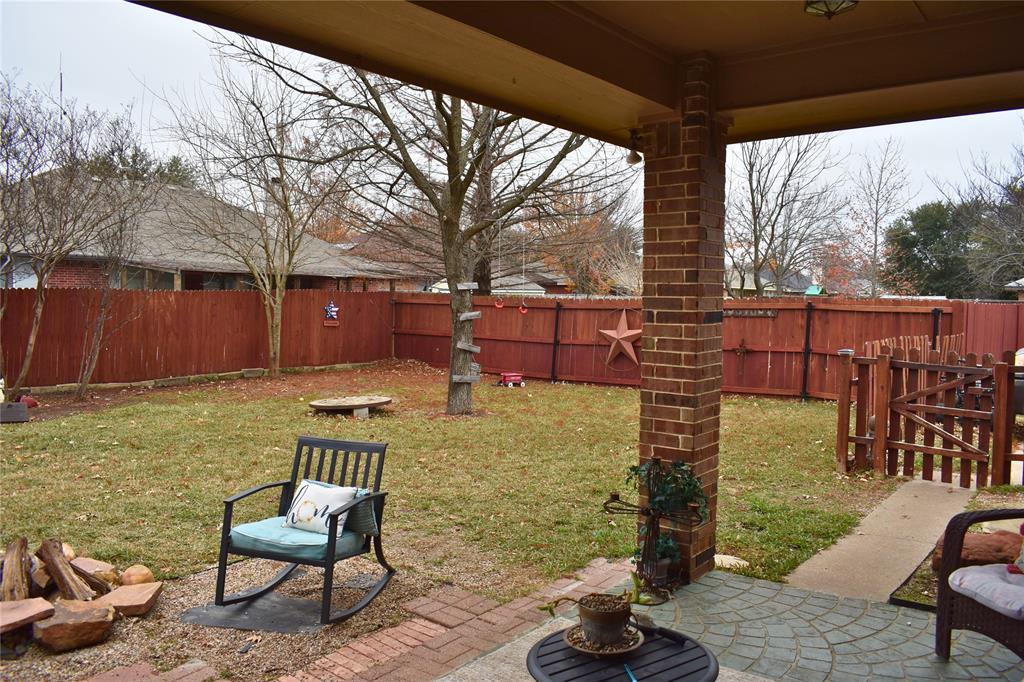 311 Ridge Hollow Trail Venus, TX 76084 - Photo 34 of 38 a view of an chairs and tables in the patio