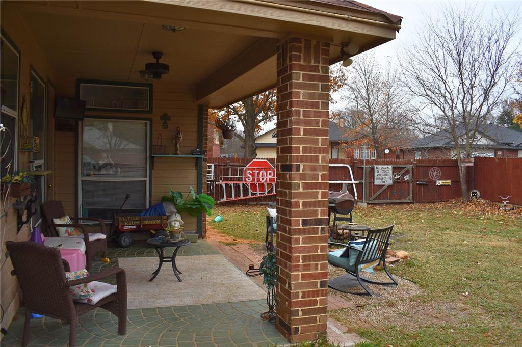311 Ridge Hollow Trail Venus, TX 76084 - Photo 35 of 38 a view of a chairs and tables in the patio