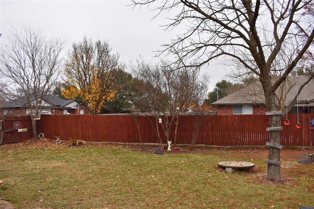 311 Ridge Hollow Trail Venus, TX 76084 - Photo 36 of 38 a view of backyard with tree