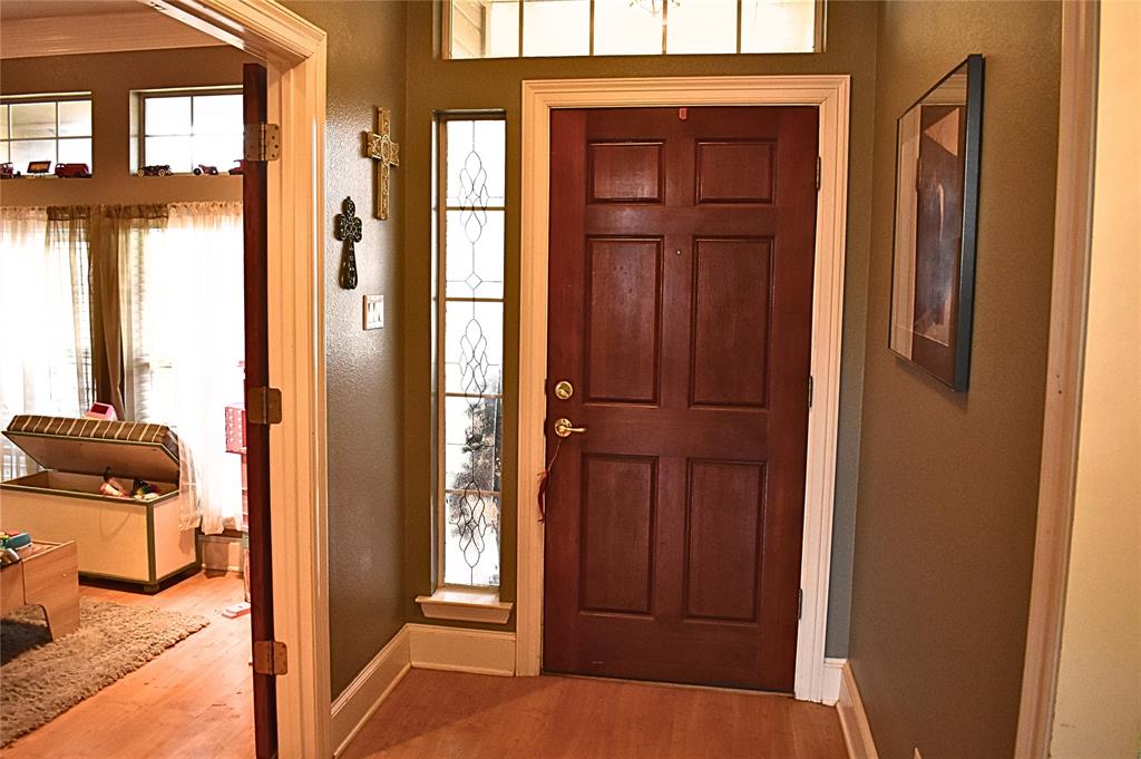 311 Ridge Hollow Trail Venus, TX 76084 - Photo 6 of 38 a view of a hallway with a door and bedroom