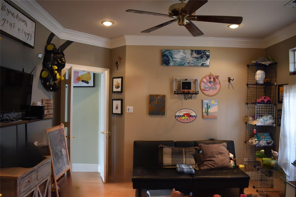 311 Ridge Hollow Trail Venus, TX 76084 - Photo 9 of 38 a living room with furniture and a flat screen tv