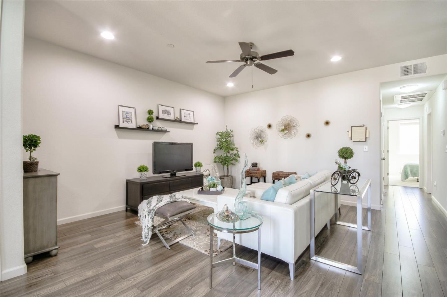 4712 Norris Canyon Road, Unit 202 San Ramon, CA 94583 - Photo 3 of 30 a living room with furniture and a wooden floor
