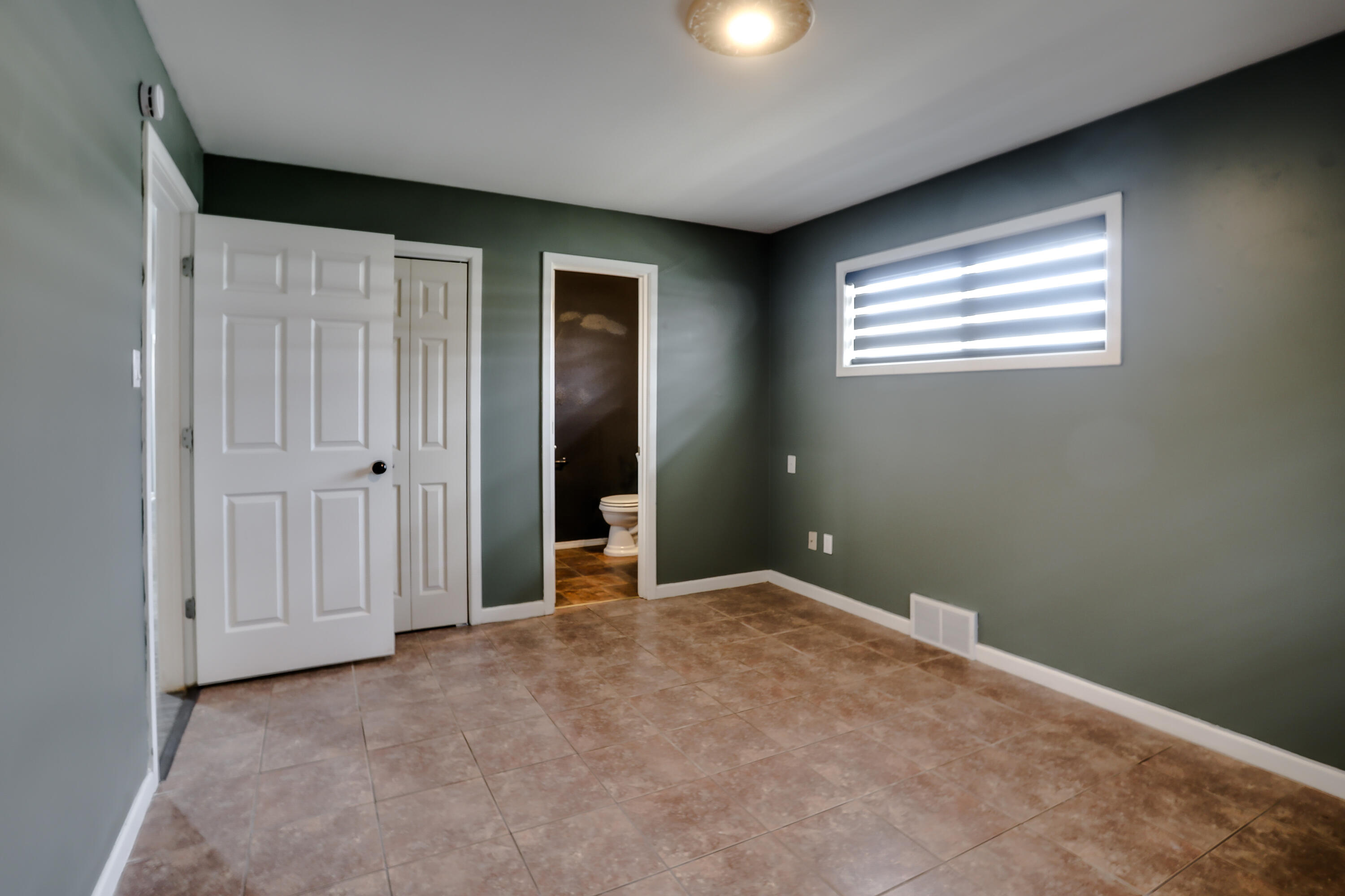 3615 47th Street Lubbock, TX 79413 - Photo 23 of 36 an empty room with windows