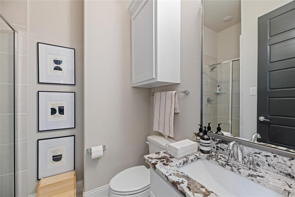 2262 Poppyvine Road Frisco, TX 75033 - Photo 15 of 40 a bathroom with a sink toilet and shower