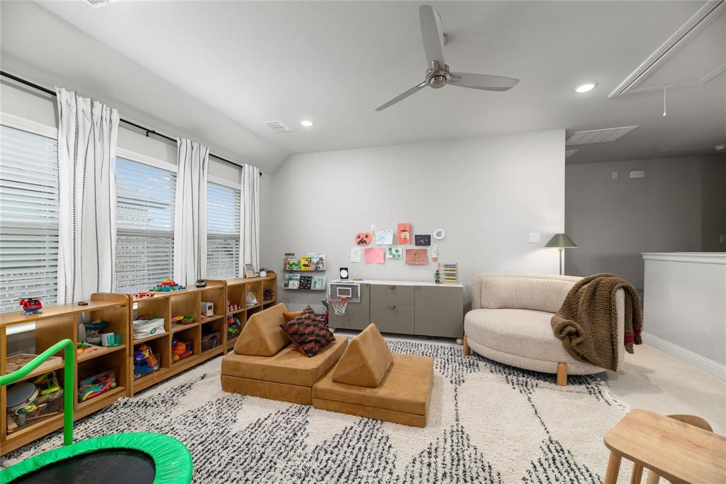 2262 Poppyvine Road Frisco, TX 75033 - Photo 33 of 40 a living room with furniture gym equipment and a large window