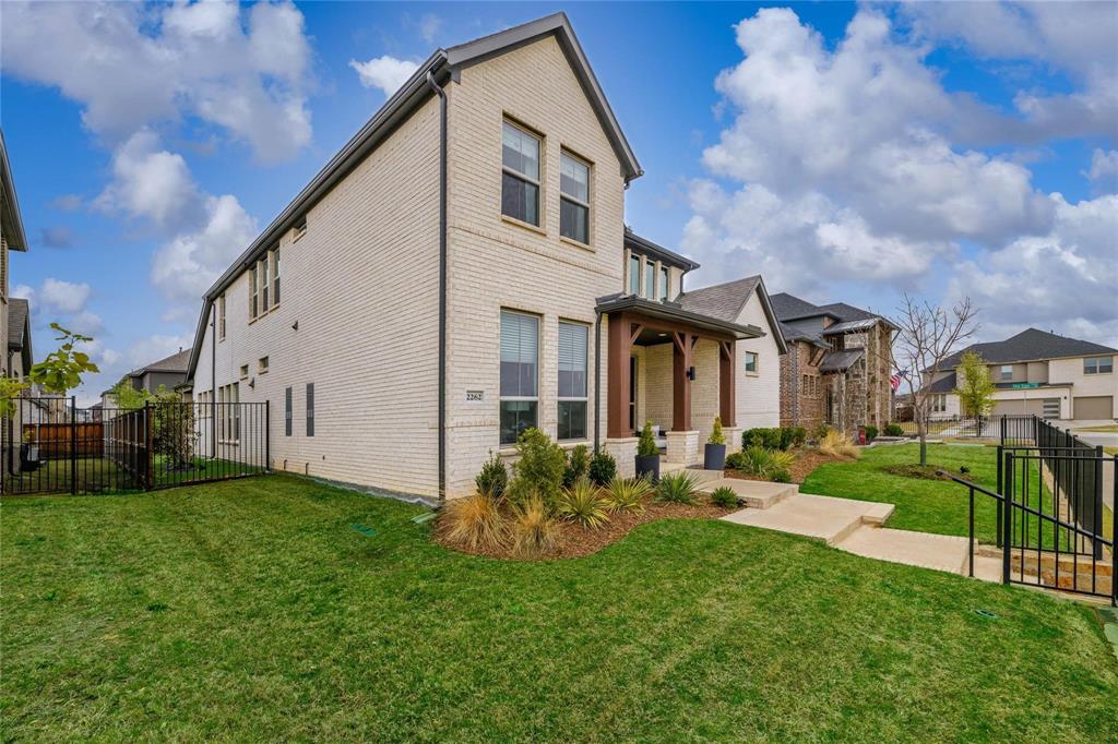 2262 Poppyvine Road Frisco, TX 75033 - Photo 34 of 40 a front view of a house with garden
